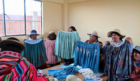 Aymara-women showing their skilfully sewed traditional skirts.